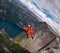 B.A.S.E. jumper in wingsuit jumps at Kjerag