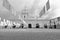 B&W image of the inner yard decorated with white flags and the Watch Tower of Montjuic Castle, Barcelona, Catalonia, Spain