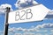 B2B - business to business - signpost arrow, sky - 3D illustration