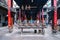 Ba Thien Hau Pagoda with stone incense burners and devoted temple worshipers in the background