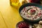 Baba ganoush or mutabal, Middle Eastern eggplant dip sauce garnished with pomegranate seeds, with various ingredients