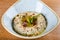 Baba ghanoush, also spelled baba ganoush or baba ghanouj, is an appetizer of mashed cooked eggplant