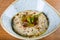Baba ghanoush, also spelled baba ganoush or baba ghanouj, is an appetizer of mashed cooked eggplant
