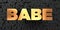 Babe - Gold text on black background - 3D rendered royalty free stock picture