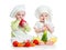 Babies boy and girl with vegetables