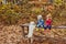 Babies and doggy in the autumn park