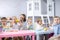 Babies eating healthy lunch in nursery or daycare centre