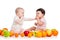 Babies girls eating healthy food fruits on white