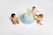 Babies Playing With Globe