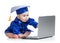 Baby in academic dress works on laptop