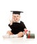 Baby in academician clothes with roll and book