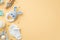 Baby accessories concept. Top view photo of knitted bunny rattle toy blue teether wooden rattle milk bottle tiny socks soother and