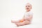 Baby with apple sitting on the floor