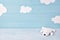 Baby background with white teddy bear and clouds