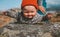 Baby balancing on rock outdoor family travel lifestyle vacation