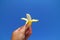 Baby banana fruit over blue sky background.