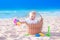 Baby in a basket on the beach