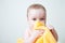 Baby After Bath Hiding Behind Yellow Towel