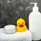 Baby bathing products, baby care, yellow rubber duck for playing in the bath.