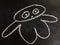 baby bee flying creature cartoon character drawn on chalkboard black background