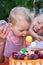 Baby with birthday cake during celebration of his first birthday party