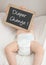 Baby with blackboard Diaper Change