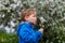 Baby blowing off a ripe dandelion