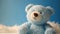 Baby blue teddy bear on light blue background. Soft cuddly stuffed animal. Baby shower for newborn. It\\\'s a boy.