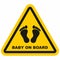 Baby on board, black silhouette of baby paws, foot, feet, triangle yellow vector sign, eps.