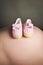 Baby booties on a pregnancy bump
