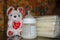 Baby bottle with fresh expresed milk, frozen breastmilk in storage bags and soft toy mouse