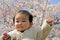 Baby boy and cherry blossoms