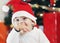 Baby boy in Christmas costume crawling