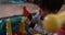 Baby boy with dark hair playing with building blocks at home