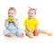 Baby boy and girl eating apples isolated