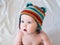 Baby boy in multicolored knitted cap