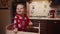 baby boy in pajamas in Christmas kitchen