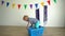 Baby boy play with laundry box and ball at home. Gimbal motion