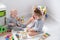 Baby boy playing with older sister with wooden toys. early children development