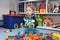 A baby boy playing with plastic blocks