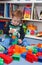 A baby boy playing with plastic blocks