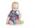 Baby boy plays with multi-colored soft cubes