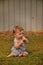 Baby boy portrait with finger up to his lips