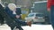 Baby boy sitting in a baby cart with a traffic on background