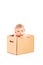 Baby boy sitting in a cardboard box
