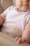 Baby boy sitting in high chair stained and messy after meal