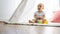 Baby Boy Sitting In Tent And Playing With Toys At Home