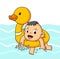 The baby boy is swimming with the duck tire in the pool