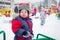 Baby boy on a winter playground