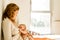 Baby breastfed by his mother in bed quiet in the morning, healthy motherhood concept